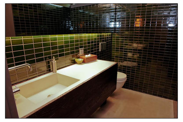 Modern green bathroom with rustic flare