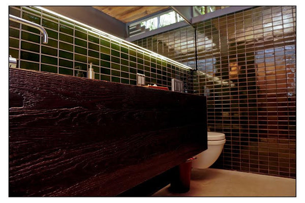 Modern green bathroom with rustic flare